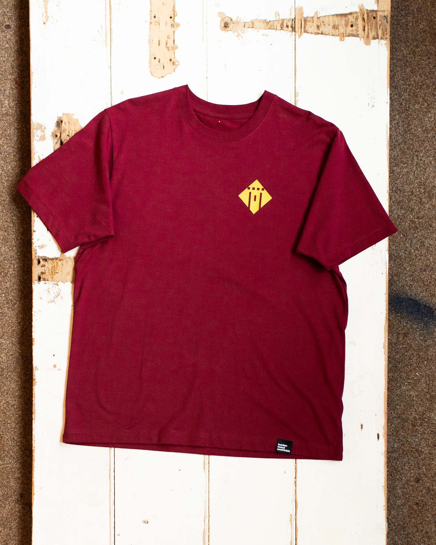 we make the bread, the castle officiale tee in burgundy